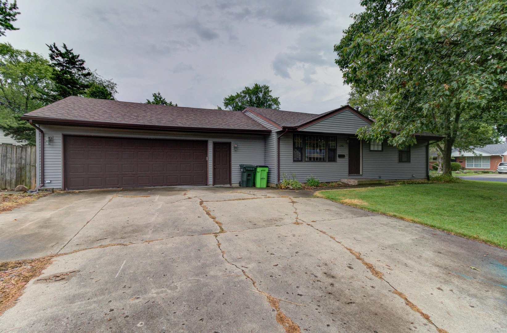 1201 Eastern Drive Urbana, IL 61801 - Photo 1 of 30 a front view of a house with a yard and garage
