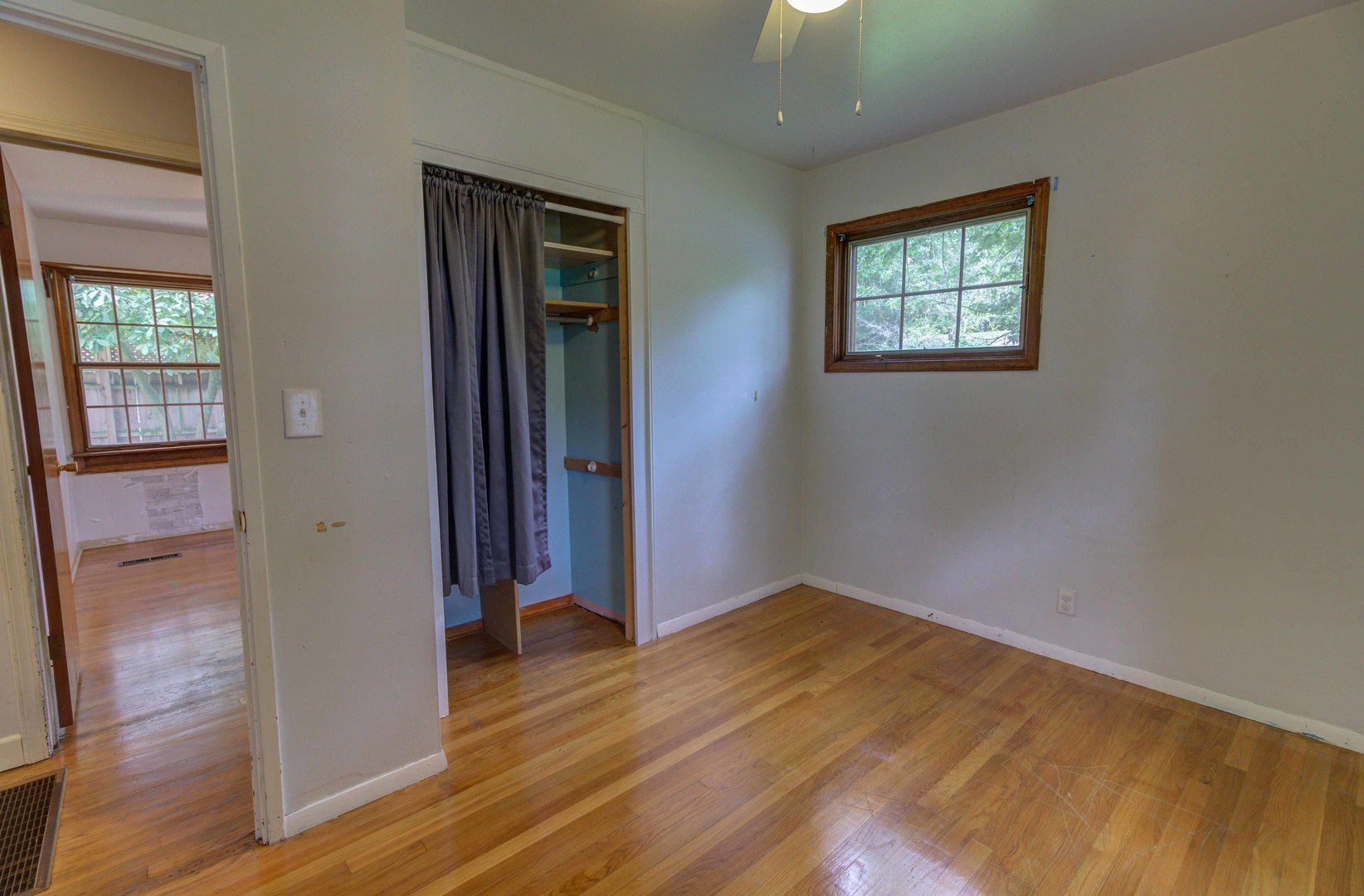 1201 Eastern Drive Urbana, IL 61801 - Photo 13 of 30 an empty room with wooden floor and windows