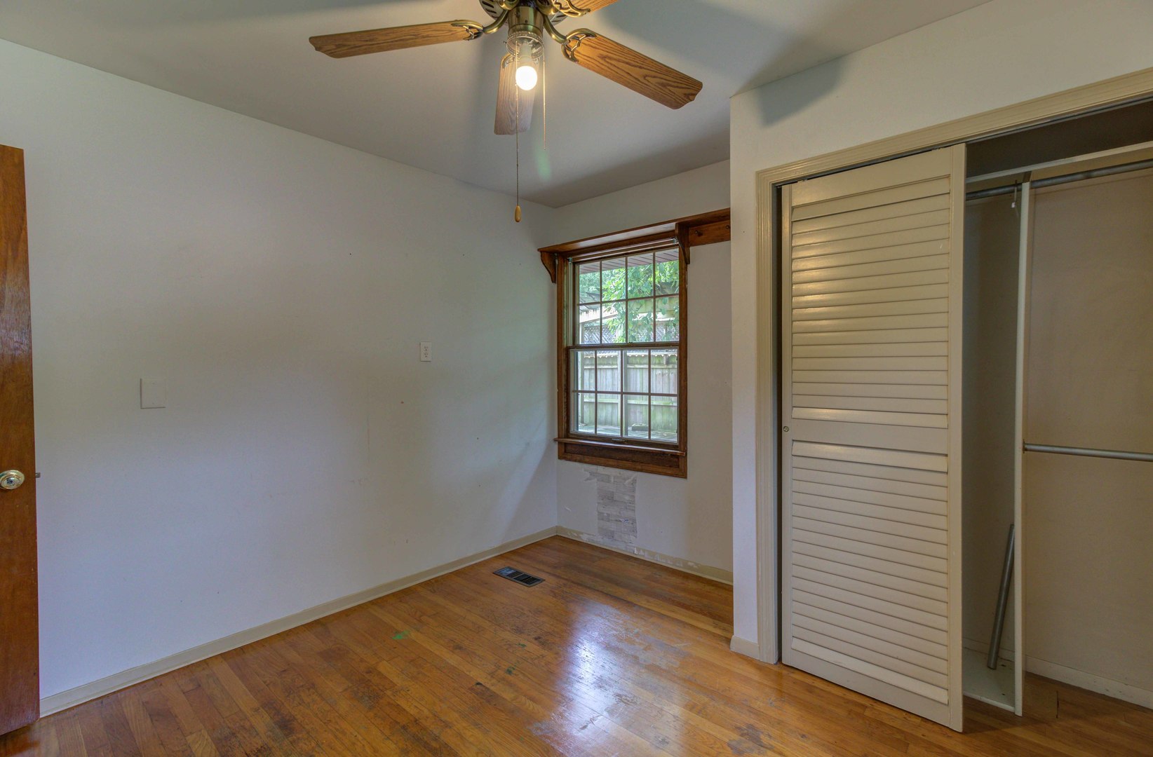 1201 Eastern Drive Urbana, IL 61801 - Photo 16 of 30 an empty room with wooden floor and windows