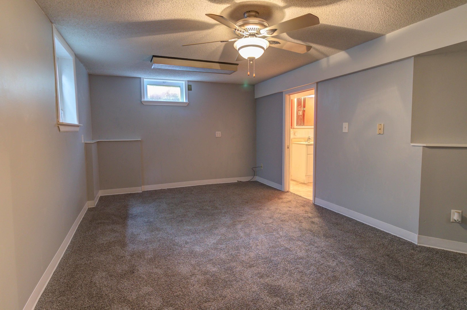 1201 Eastern Drive Urbana, IL 61801 - Photo 19 of 30 en empty room with windows and ceiling fan