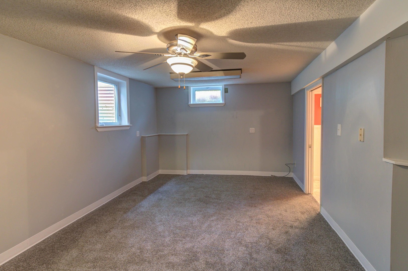 1201 Eastern Drive Urbana, IL 61801 - Photo 21 of 30 en empty room with windows and chandelier fan