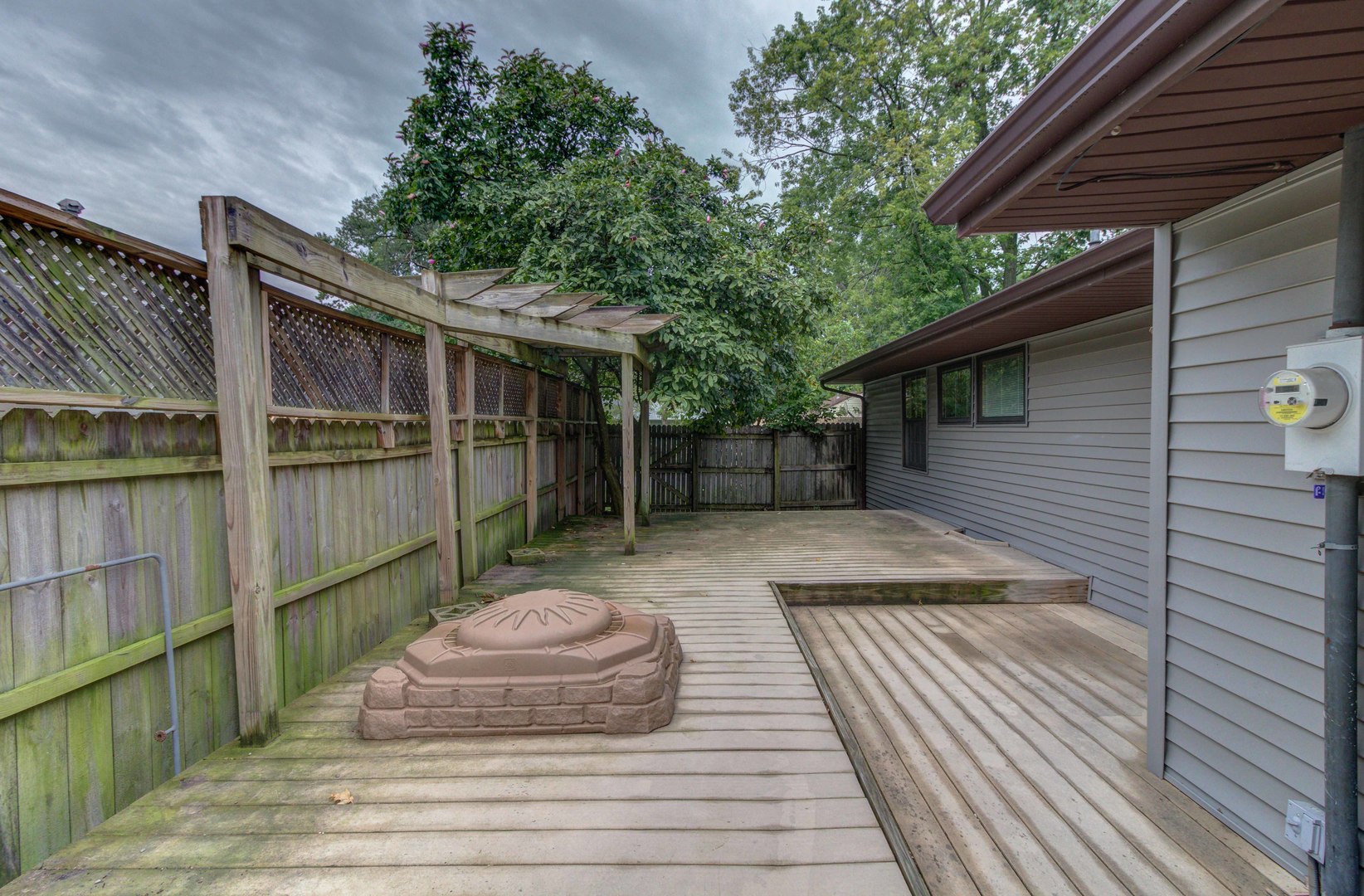 1201 Eastern Drive Urbana, IL 61801 - Photo 30 of 30 a view of a patio with table and chairs potted plants with wooden floor and fence