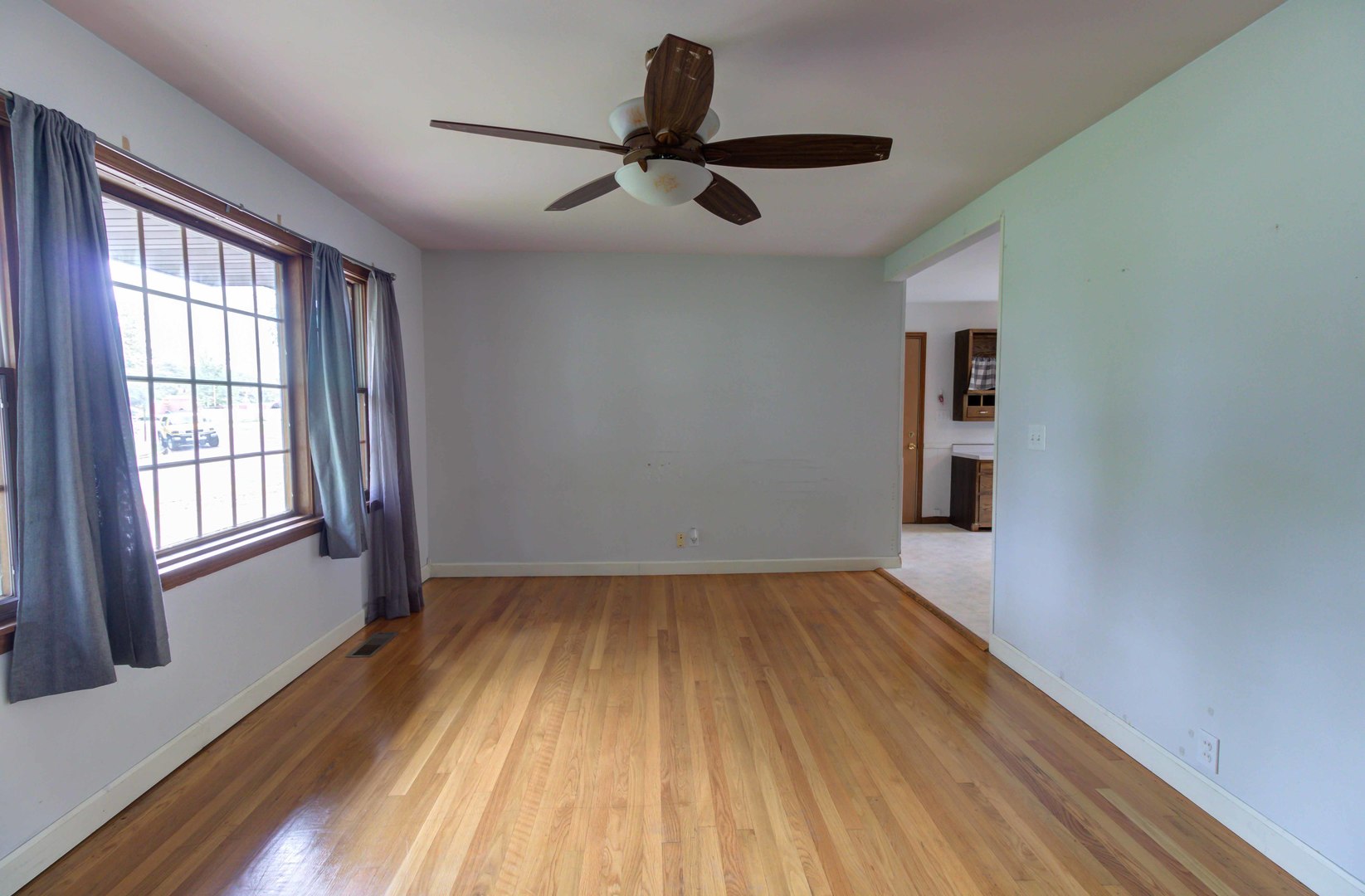 1201 Eastern Drive Urbana, IL 61801 - Photo 7 of 30 a view of empty room with wooden floor and fan