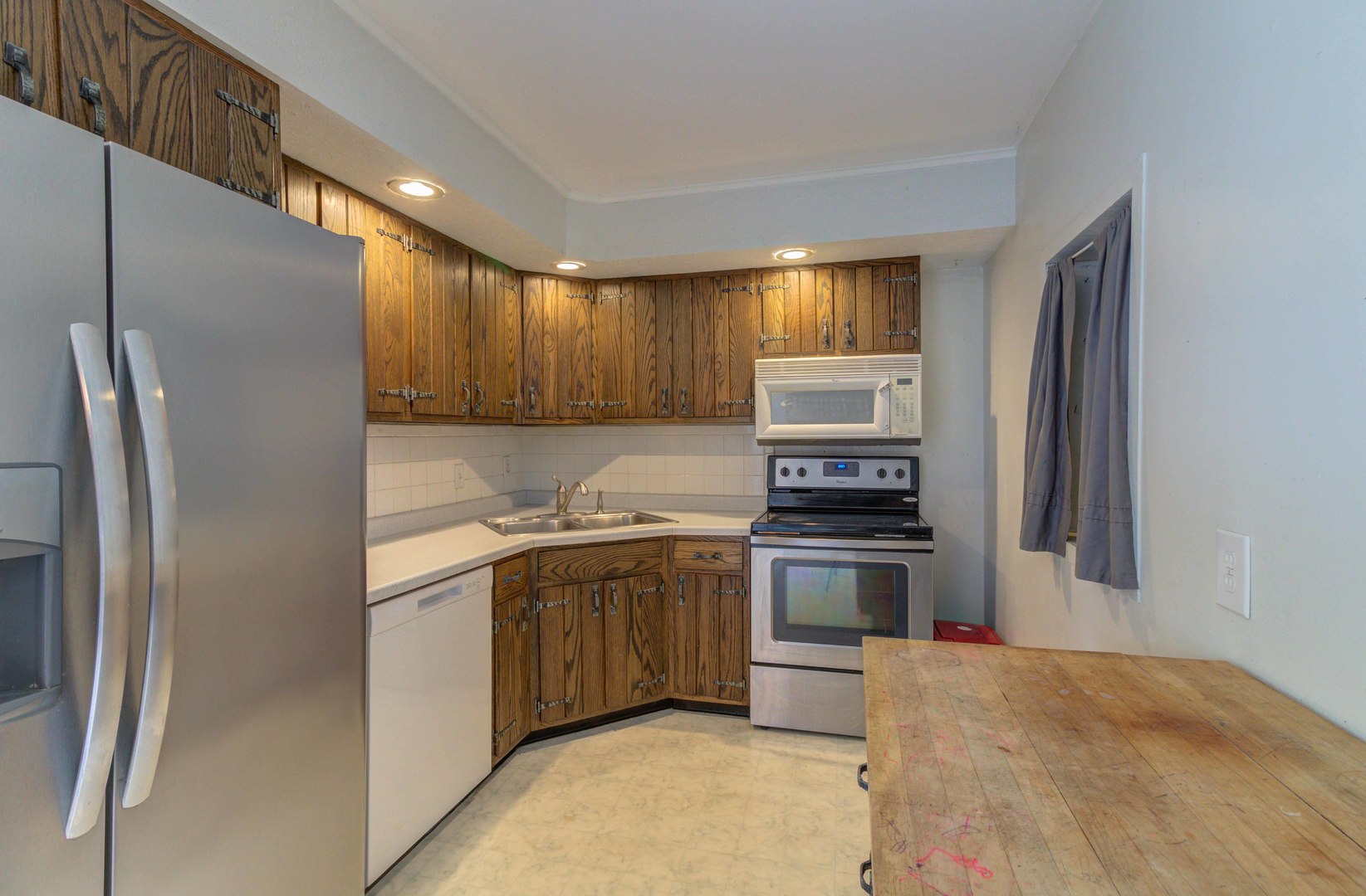1201 Eastern Drive Urbana, IL 61801 - Photo 8 of 30 a kitchen with stainless steel appliances granite countertop a refrigerator stove and sink