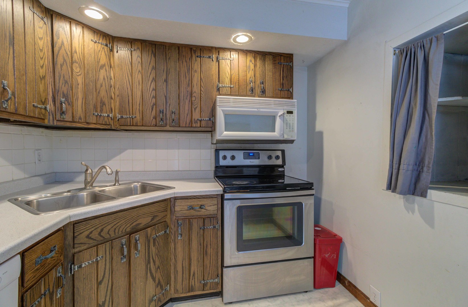 1201 Eastern Drive Urbana, IL 61801 - Photo 9 of 30 a kitchen with a sink stove and cabinets