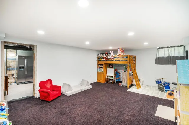 a living room with a table and gym equipment