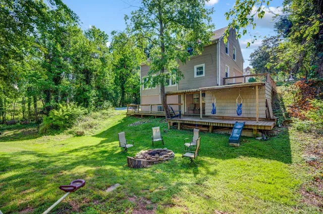 a view of backyard with a garden and entertaining space