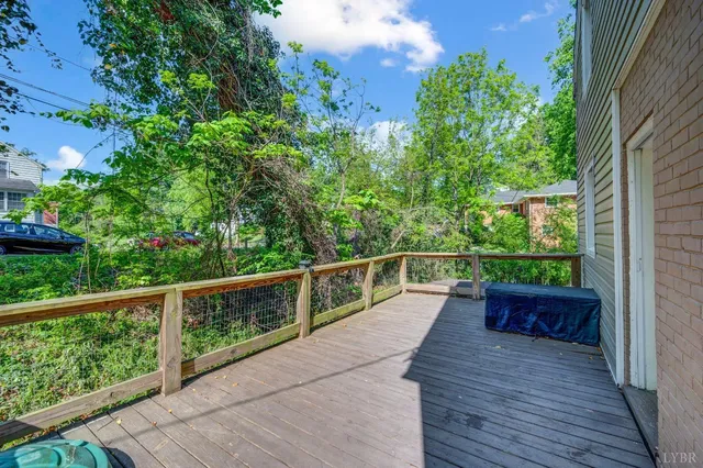 a view of a balcony with wooden floor