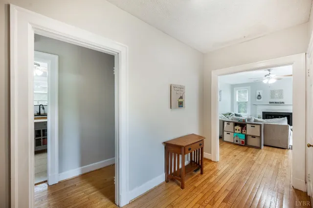 a view of kitchen with sink and wooden floor