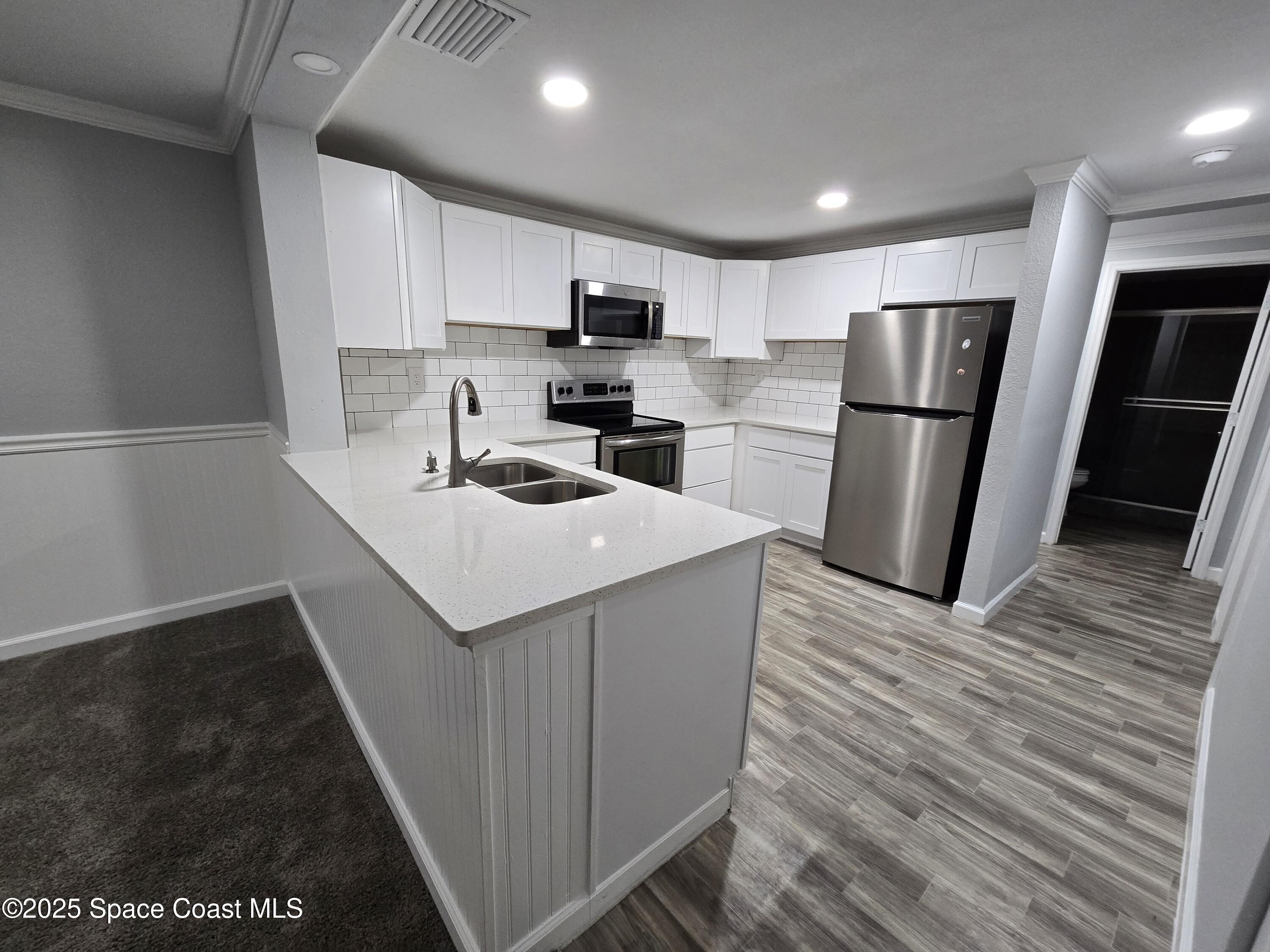 1700 Bottlebrush Drive, Unit 101 Palm Bay, FL 32905 - Photo 7 of 14 Kitchen