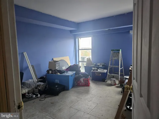 a living room with furniture and a gate