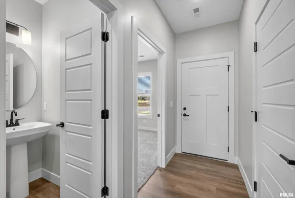 a view of hallway with washer and dryer