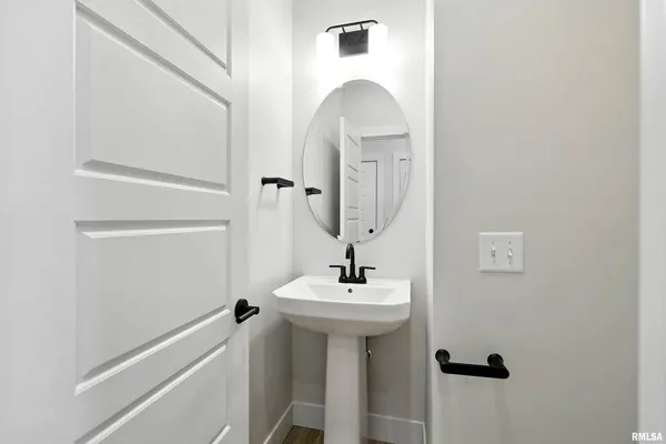 a bathroom with a sink a mirror and shower