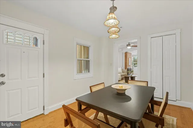 a view of a dining room with furniture and chandelier