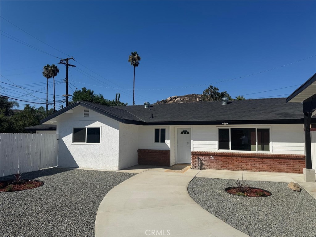 5276 Almar Street Riverside, CA 92505 - Photo 2 of 13 a front view of a house with a garden