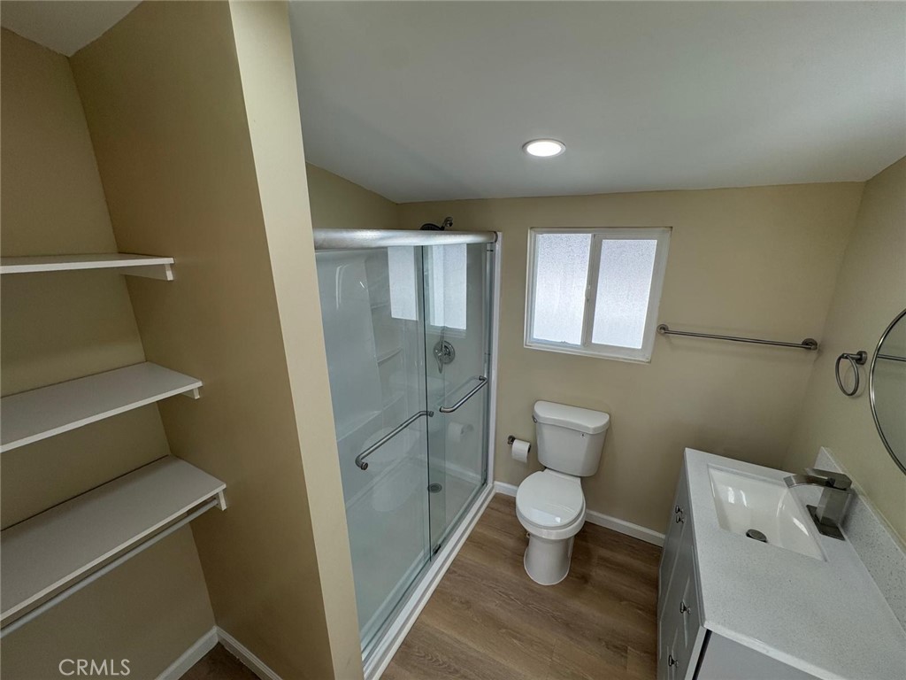 5276 Almar Street Riverside, CA 92505 - Photo 7 of 13 a bathroom with a toilet and a shower