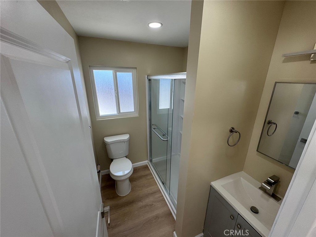 5276 Almar Street Riverside, CA 92505 - Photo 9 of 13 a bathroom with a toilet and a sink