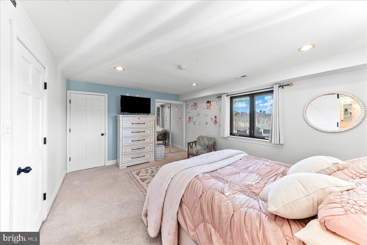 1056 Lenape Road West Chester, PA 19382 - Photo 27 of 48 a bedroom with a large bed and a tv