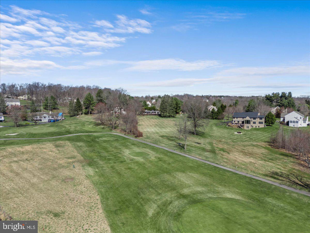 1056 Lenape Road West Chester, PA 19382 - Photo 45 of 48 a view of a golf course with a lake