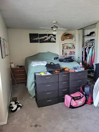 a bedroom with a bed and gym equipment