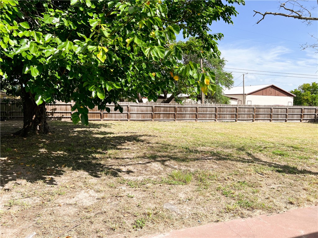 933 South Rife Street Aransas Pass, TX 78336 - Photo 15 of 17 a view of yard with tree and green space