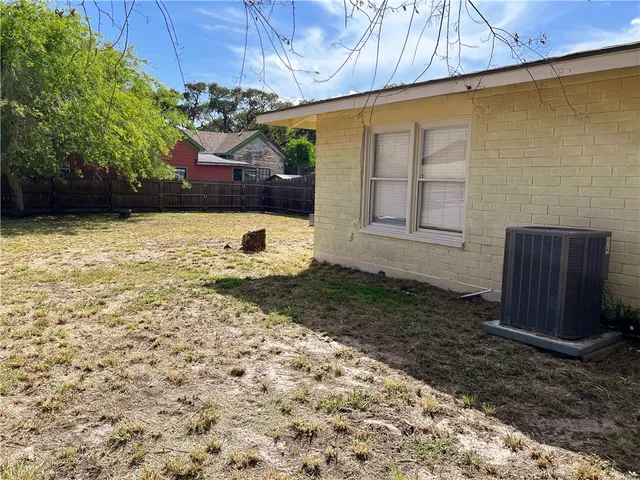 a view of a backyard of the house