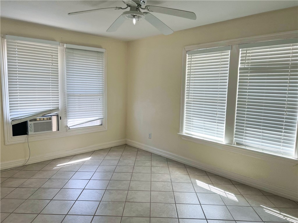 933 South Rife Street Aransas Pass, TX 78336 - Photo 6 of 17 a view of an empty room with a window