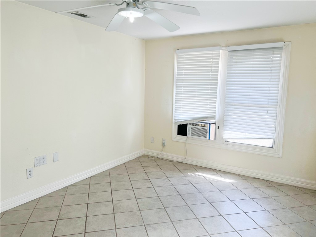 933 South Rife Street Aransas Pass, TX 78336 - Photo 7 of 17 an empty room with windows