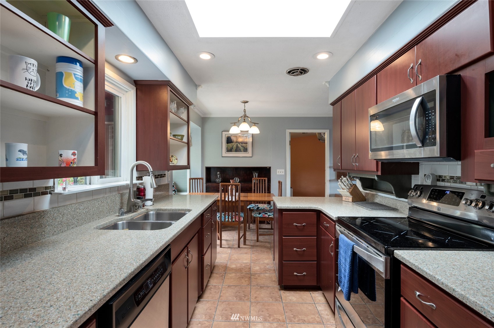 208 Reeds Lane Everson, WA 98247 - Photo 11 of 36 a kitchen with stainless steel appliances granite countertop a sink stove and refrigerator