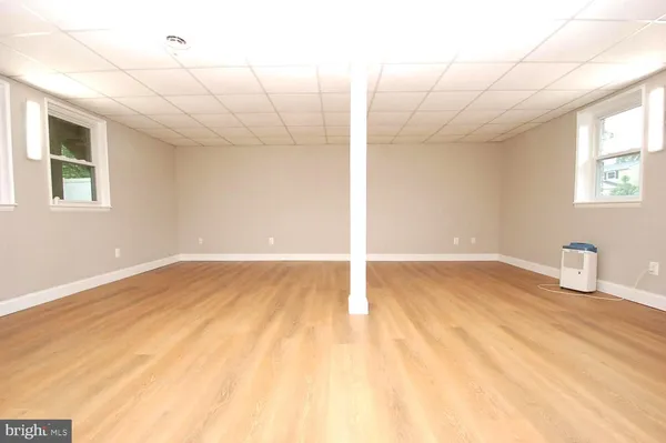 a view of an empty room with windows
