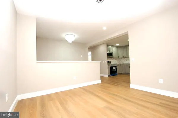 a view of a kitchen with a sink and cabinets
