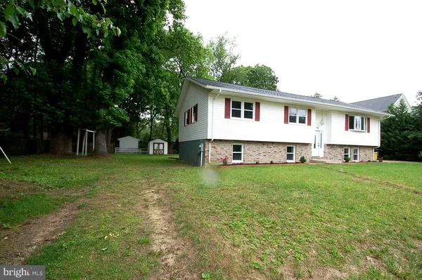 a view of a backyard with sitting area