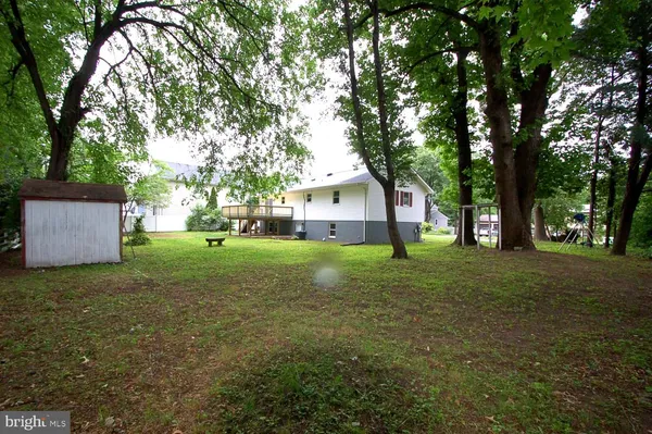 a view of yard with patio and green space