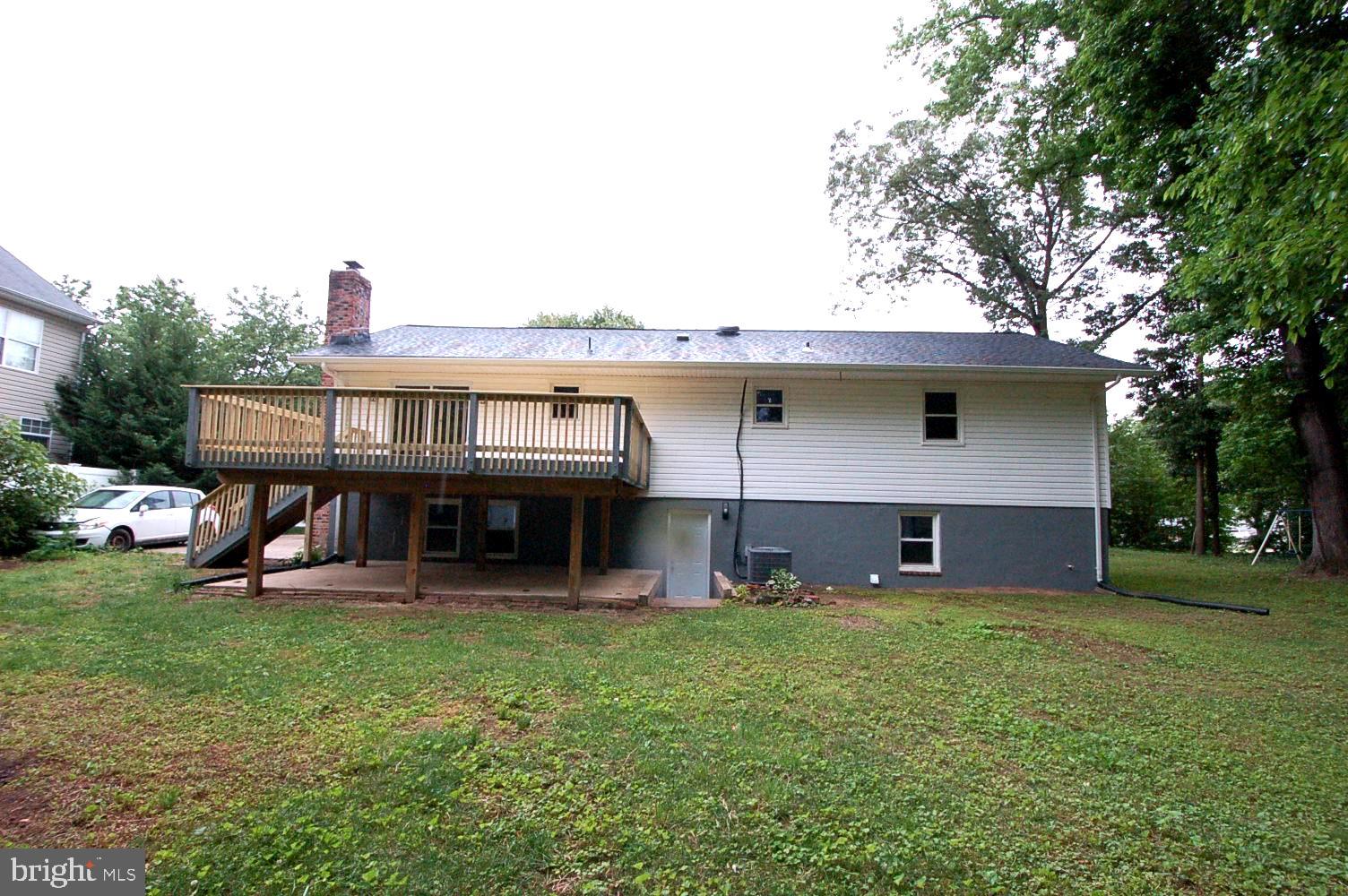 780 Stinchcomb Road Severna Park, MD 21146 - Photo 49 of 58 a view of a house with a backyard and a tree