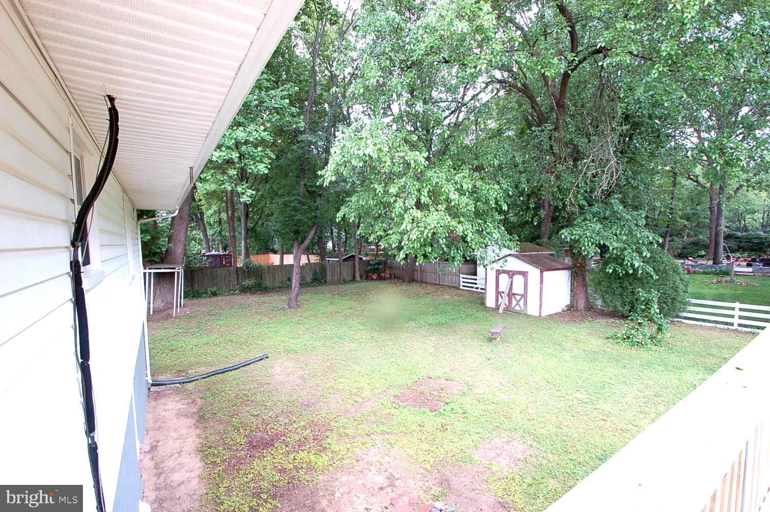 780 Stinchcomb Road Severna Park, MD 21146 - Photo 53 of 58 a view of a backyard with sitting area
