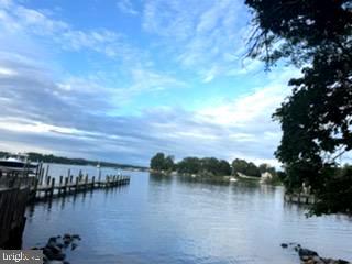 780 Stinchcomb Road Severna Park, MD 21146 - Photo 58 of 58 a view of lake with boats and trees in the background