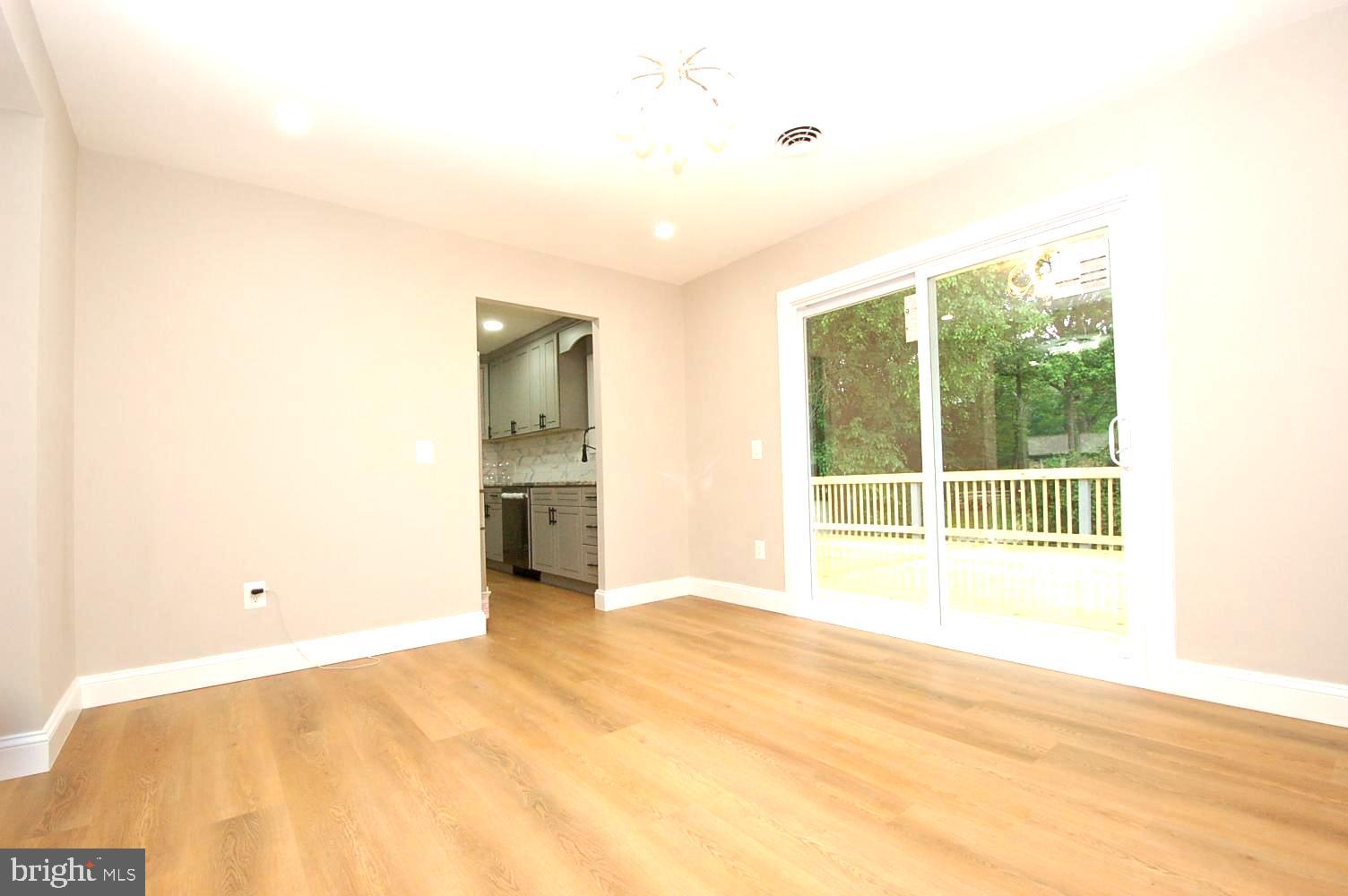 780 Stinchcomb Road Severna Park, MD 21146 - Photo 7 of 58 a view of an empty room with a window