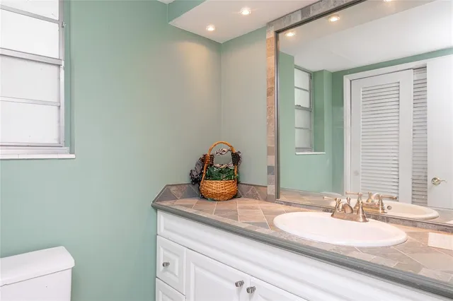 a bedroom with a bed and a table in it