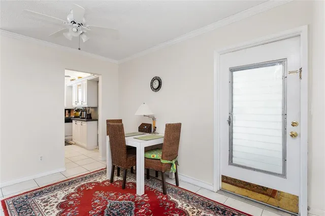 a kitchen with stainless steel appliances a stove a sink cabinets and a window