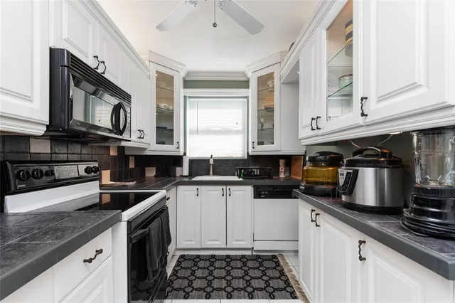 a view of a dining room with furniture and a window