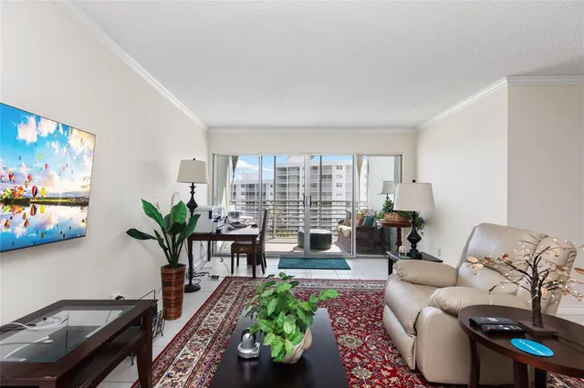 a view of a dining room with furniture and a window