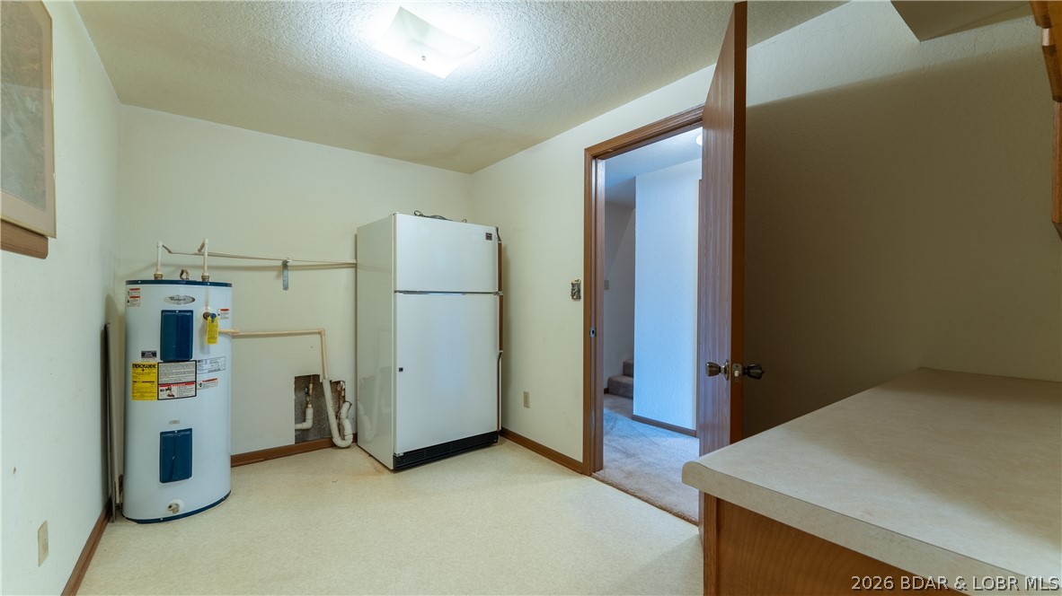 108 River Wood Road Camdenton, MO 65020 - Photo 24 of 32 Huge mechanical room with the water heater and ext