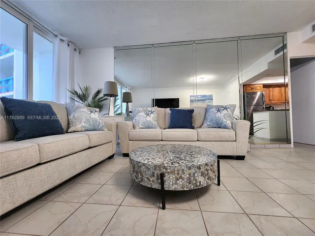 a living room with furniture and a couch