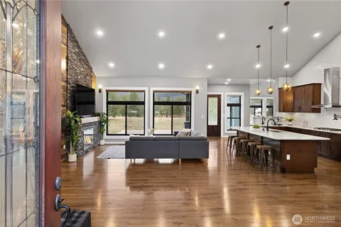 a kitchen with stainless steel appliances wooden cabinets and a stove top oven