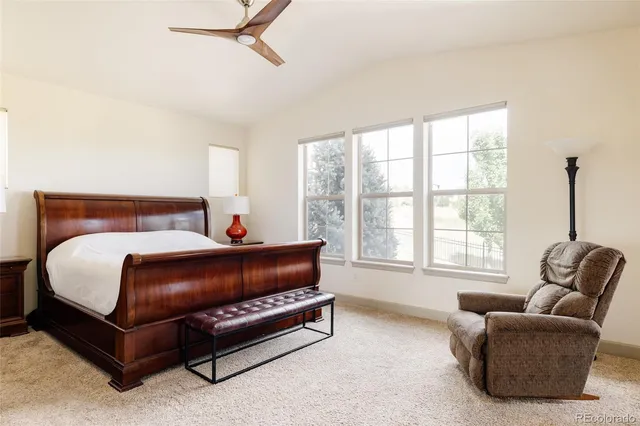 a bedroom with furniture and a window