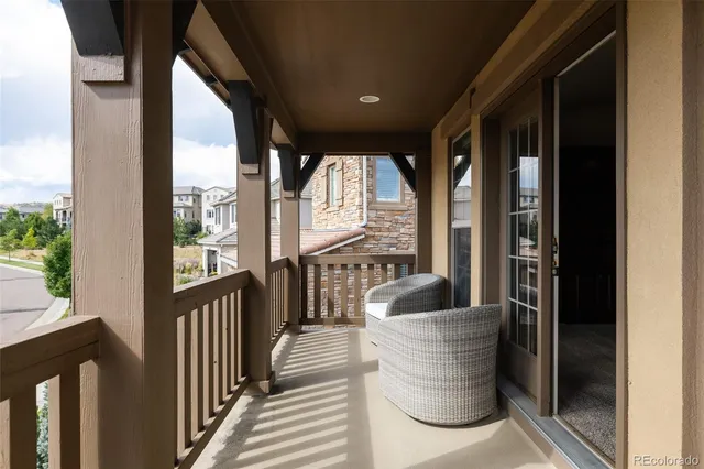 a view of a big house with a big yard and large tree