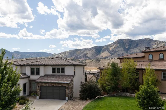 a view of a kitchen with furniture and staircase