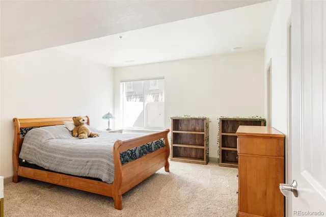 a bedroom with a workspace