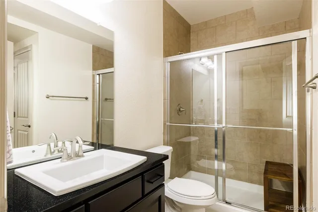 a terrace with outdoor seating and city view