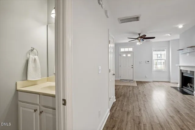 a view of a room with a hardwood and a fireplace
